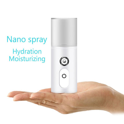White portable facial humidifier with a clear water tank and a power button, for on-the-go moisturizing. - Image 9