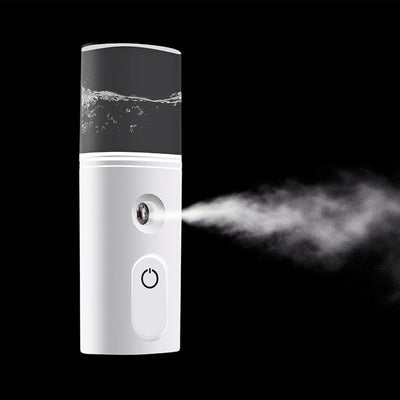 White portable facial humidifier with a clear water tank and a power button, for on-the-go moisturizing. - Image 11