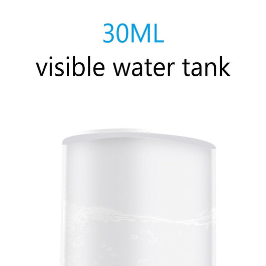 White portable facial humidifier with a clear water tank and a power button, for on-the-go moisturizing. - Image 14