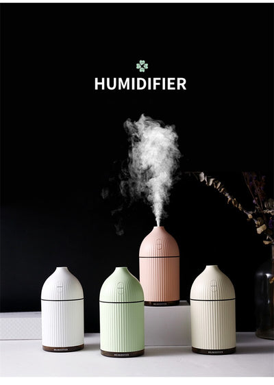 Pink ribbed aromatherapy diffuser and ultrasonic humidifier with a transparent brown base and control buttons. - Image 6
