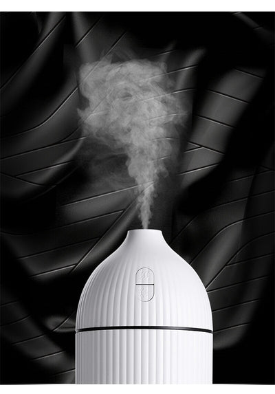 Pink ribbed aromatherapy diffuser and ultrasonic humidifier with a transparent brown base and control buttons. - Image 9