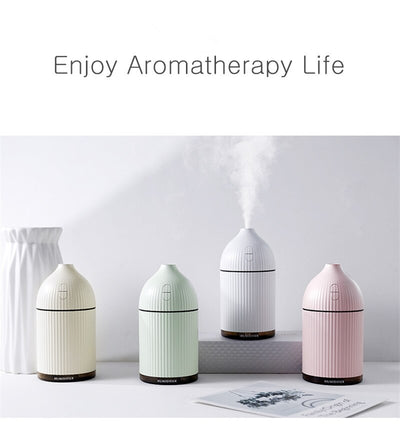 Pink ribbed aromatherapy diffuser and ultrasonic humidifier with a transparent brown base and control buttons. - Image 10