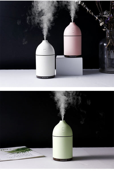 Pink ribbed aromatherapy diffuser and ultrasonic humidifier with a transparent brown base and control buttons. - Image 11