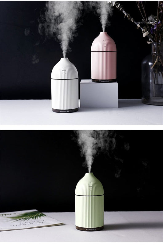 Pink ribbed aromatherapy diffuser and ultrasonic humidifier with a transparent brown base and control buttons. - Image 11