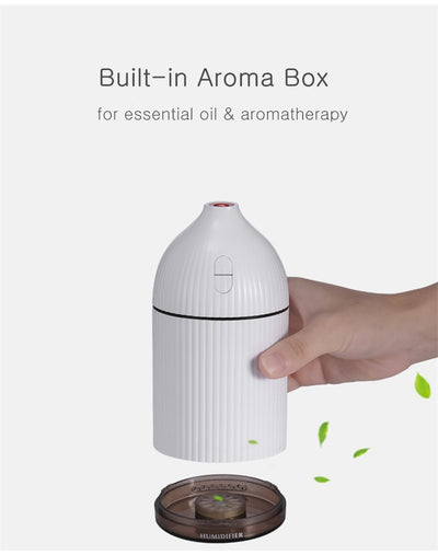 Pink ribbed aromatherapy diffuser and ultrasonic humidifier with a transparent brown base and control buttons. - Image 12