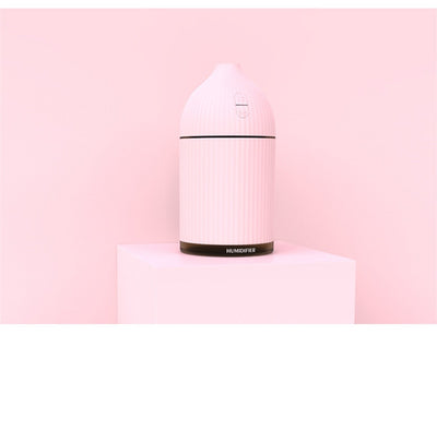 Pink ribbed aromatherapy diffuser and ultrasonic humidifier with a transparent brown base and control buttons. - Image 14