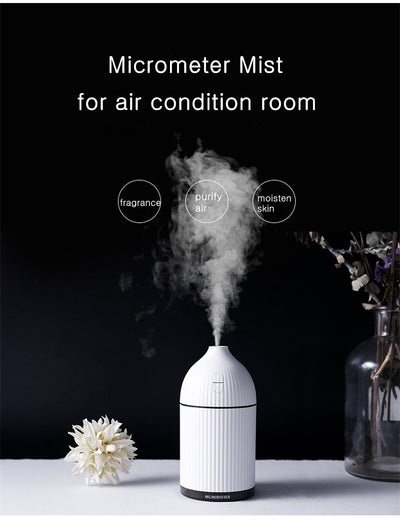 Pink ribbed aromatherapy diffuser and ultrasonic humidifier with a transparent brown base and control buttons. - Image 15