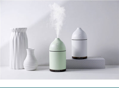 Pink ribbed aromatherapy diffuser and ultrasonic humidifier with a transparent brown base and control buttons. - Image 19