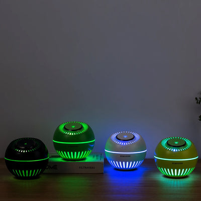 Dark green spherical humidifier with a textured top, control icons, and "HUMIDIFIER" printed on its side. - Image 7