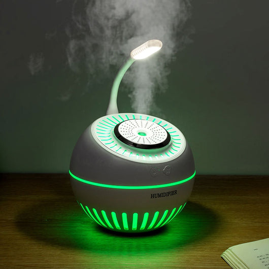Dark green spherical humidifier with a textured top, control icons, and "HUMIDIFIER" printed on its side. - Image 9