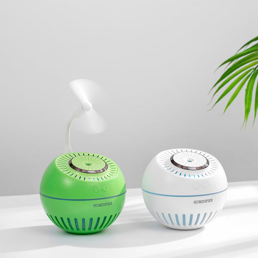 Dark green spherical humidifier with a textured top, control icons, and "HUMIDIFIER" printed on its side. - Image 11