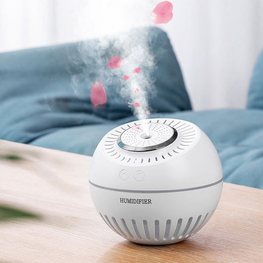 Dark green spherical humidifier with a textured top, control icons, and "HUMIDIFIER" printed on its side. - Image 13