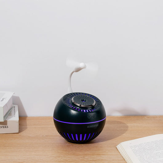 Dark green spherical humidifier with a textured top, control icons, and "HUMIDIFIER" printed on its side. - Image 14