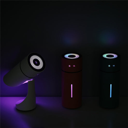 Teal cylindrical USB charging humidifier with a ribbed texture, black water level indicator, and two control buttons. - Image 15