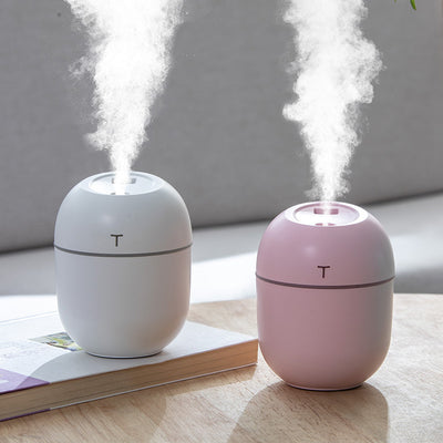 Teal egg-shaped USB humidifier with a glowing blue light band and a 'T' shaped indicator on top. - Image 6
