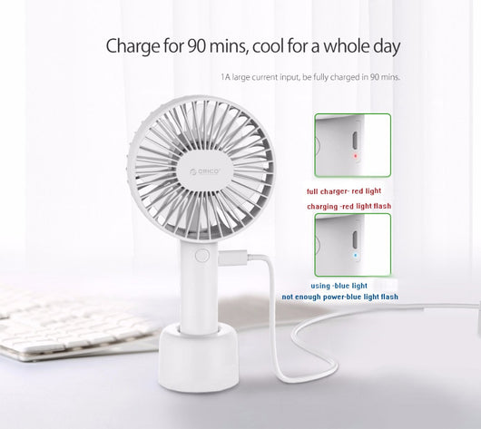 White ORICO FH1 handheld USB fan with charging dock, USB cable, and user manuals on a wooden desk. - Image 11