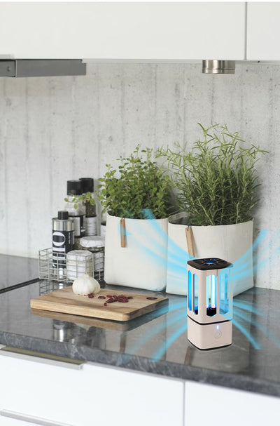 White portable UV disinfection lamp with a black top and base, featuring a visible blue UV light tube and power button. - Image 11