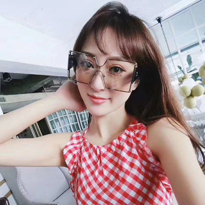 Oversized rimless square sunglasses with gradient brown lenses, black temples, and gold-tone accents. - Image 11
