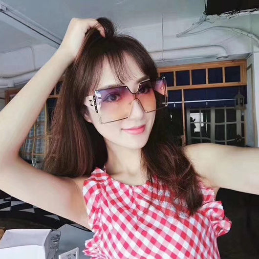 Oversized rimless square sunglasses with gradient brown lenses, black temples, and gold-tone accents. - Image 12