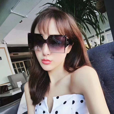 Oversized rimless square sunglasses with gradient brown lenses, black temples, and gold-tone accents. - Image 14