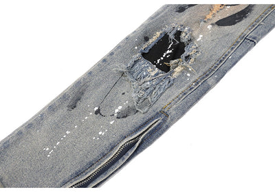 Jeans Rotos con Detalles de Tinta y Parches Desgastados - Image 15