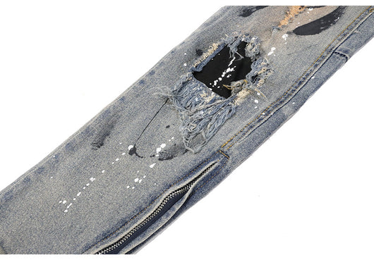 Jeans Rotos con Detalles de Tinta y Parches Desgastados - Image 15