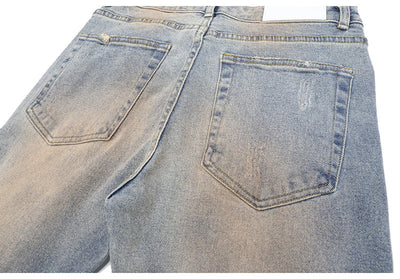 Jeans Rotos con Detalles de Tinta y Parches Desgastados - Image 17