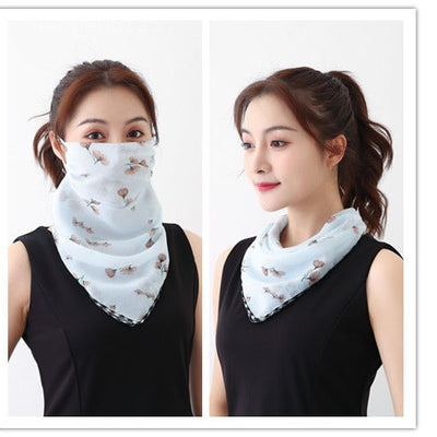 White women's UV protection scarf with black speckle pattern, worn as a face mask and neck scarf. - Image 31