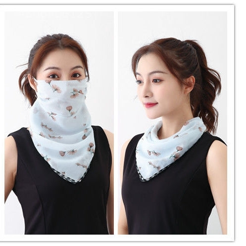 White women's UV protection scarf with black speckle pattern, worn as a face mask and neck scarf. - Image 31