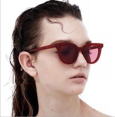 White vintage cat-eye sunglasses with dark lenses, angled on a clean white background. - Image 3