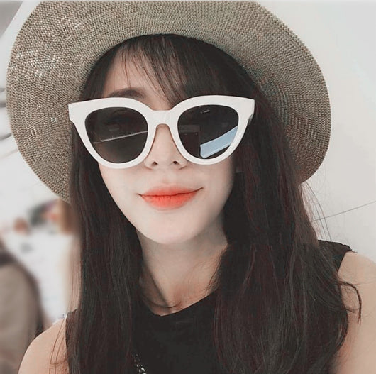 White vintage cat-eye sunglasses with dark lenses, angled on a clean white background. - Image 5