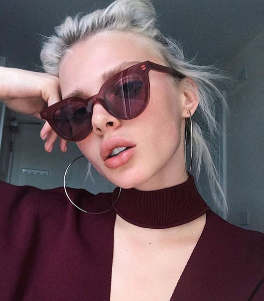 White vintage cat-eye sunglasses with dark lenses, angled on a clean white background. - Image 6