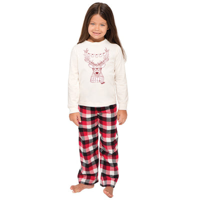 Child wearing a cream long-sleeve pajama top with a reindeer graphic and red, black, and white plaid pajama pants. - Image 7