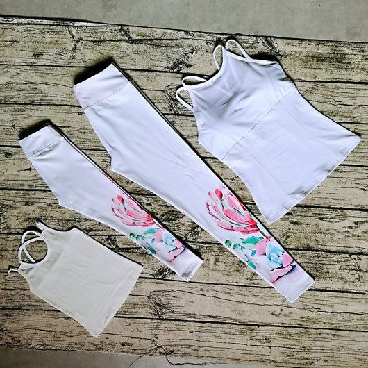 White parent-child yoga suit with tropical leaf print leggings and matching sleeveless tops. - Image 12
