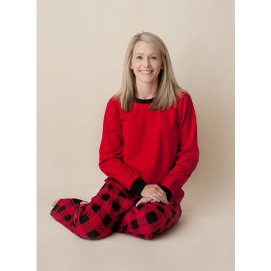Family of four wearing matching red and black buffalo plaid Christmas pajamas, featuring solid red long-sleeve tops and plaid pants. - Image 15