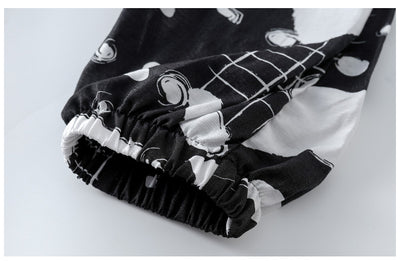 Girls' two-piece outfit with a black sleeveless top and black and white camouflage wide-leg suspender pants. - Image 14