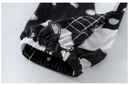 Girls' two-piece outfit with a black sleeveless top and black and white camouflage wide-leg suspender pants. - Image 14