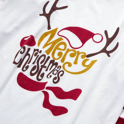 Matching navy blue family Christmas pajamas with white Christmas tree and "Merry Christmas" text, paired with patterned bottoms. - Image 14
