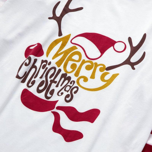 Matching navy blue family Christmas pajamas with white Christmas tree and "Merry Christmas" text, paired with patterned bottoms. - Image 14