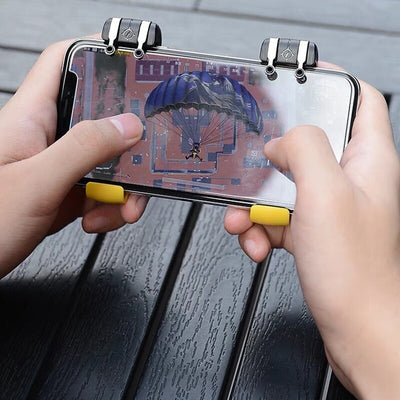 Black and silver mobile gaming trigger controller attached to a silver smartphone, showing the left button and game screen. - Image 12