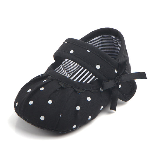 Black baby girl Mary Jane shoes with white polka dots, a strap, bow accent, and striped lining. - Image 12