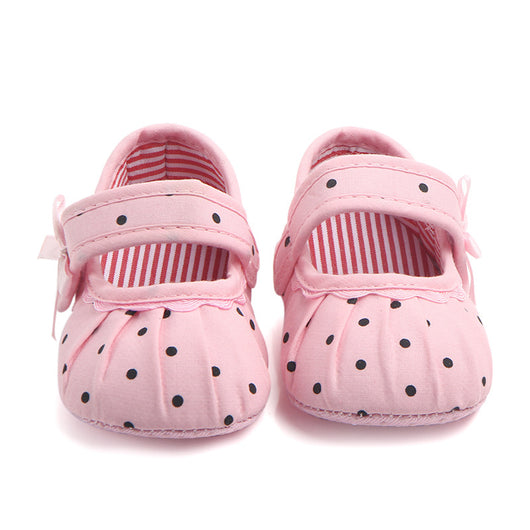 Black baby girl Mary Jane shoes with white polka dots, a strap, bow accent, and striped lining. - Image 13