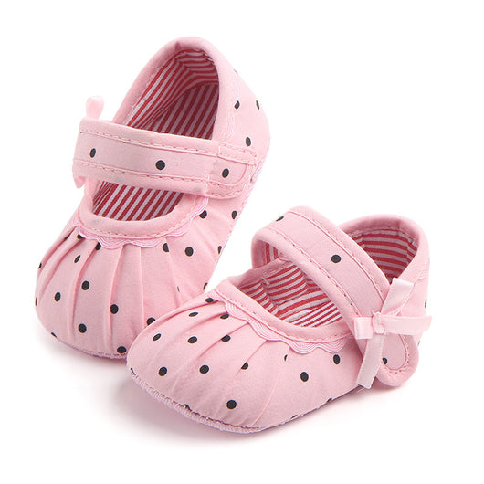 Black baby girl Mary Jane shoes with white polka dots, a strap, bow accent, and striped lining. - Image 15