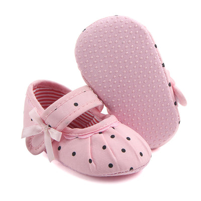 Black baby girl Mary Jane shoes with white polka dots, a strap, bow accent, and striped lining. - Image 16