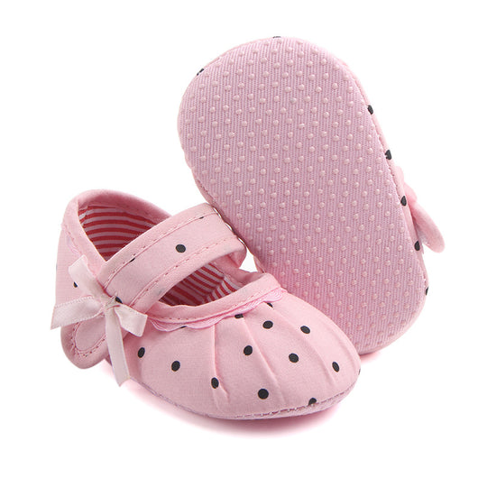 Black baby girl Mary Jane shoes with white polka dots, a strap, bow accent, and striped lining. - Image 16
