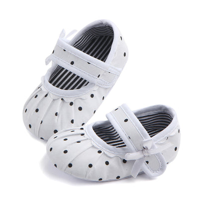 Black baby girl Mary Jane shoes with white polka dots, a strap, bow accent, and striped lining. - Image 19