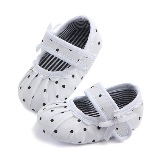 Black baby girl Mary Jane shoes with white polka dots, a strap, bow accent, and striped lining. - Image 19