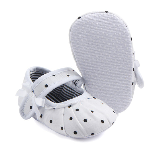 Black baby girl Mary Jane shoes with white polka dots, a strap, bow accent, and striped lining. - Image 21