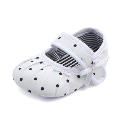 Black baby girl Mary Jane shoes with white polka dots, a strap, bow accent, and striped lining. - Image 22