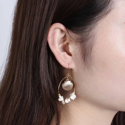 Aretes Estrella de Cinco Puntas en Metal Salvaje con Concha Marina - Image 15